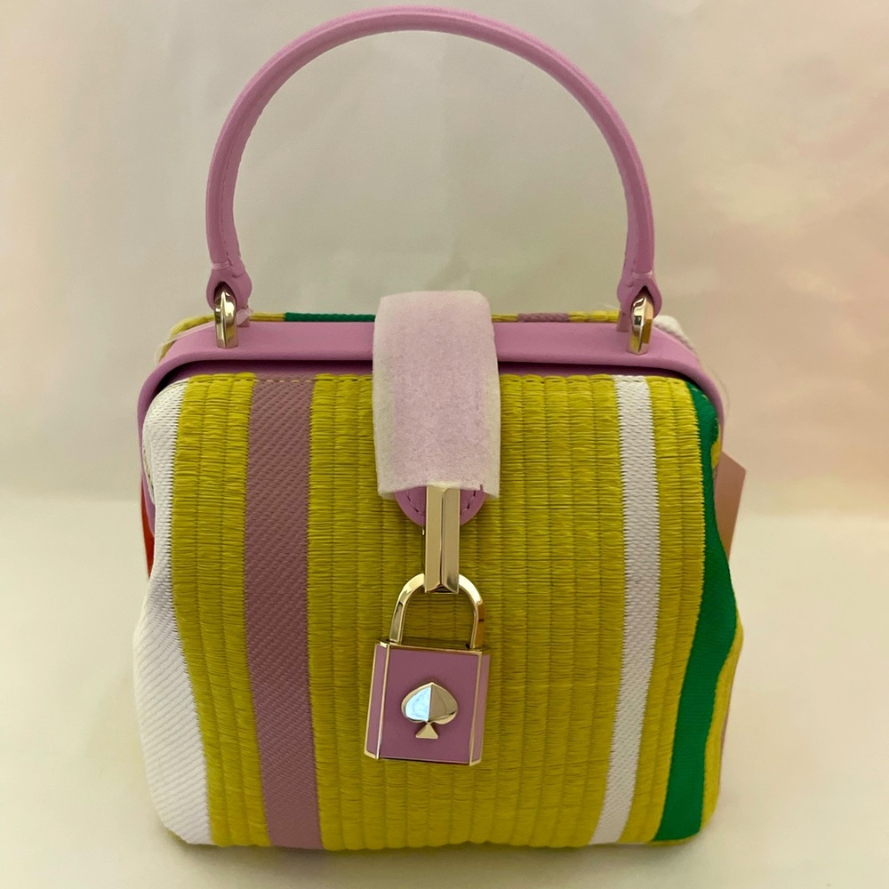 Kate Spade with soft colors, with cross body strap. New